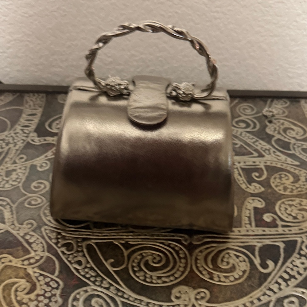 Rodo Metallic gold Clutch